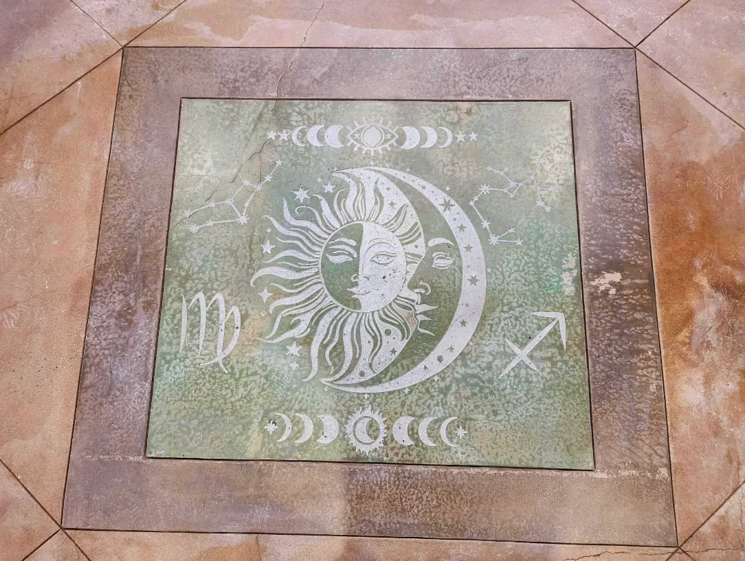 Celestial sun and moon design engraved in stone