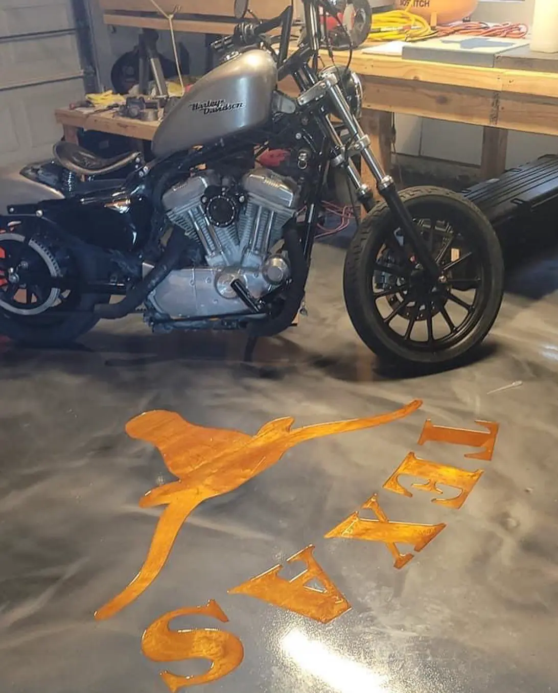 Texas longhorn design engraved in orange on a garage floor