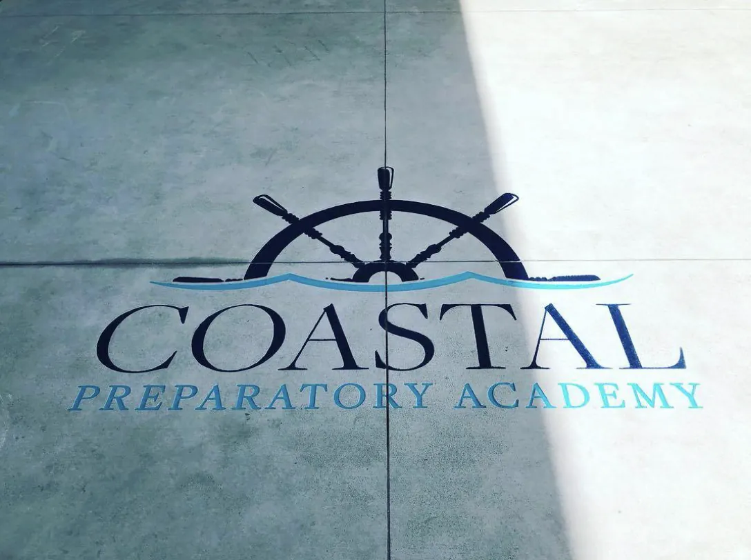 Coastal Preparatory Academy logo engraved in concrete
